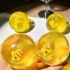 Coconut oil ball with bee charms inside soft squeeze anti-stress squishy toy