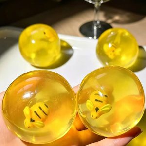 Coconut oil ball with bee charms inside soft squeeze anti-stress squishy toy